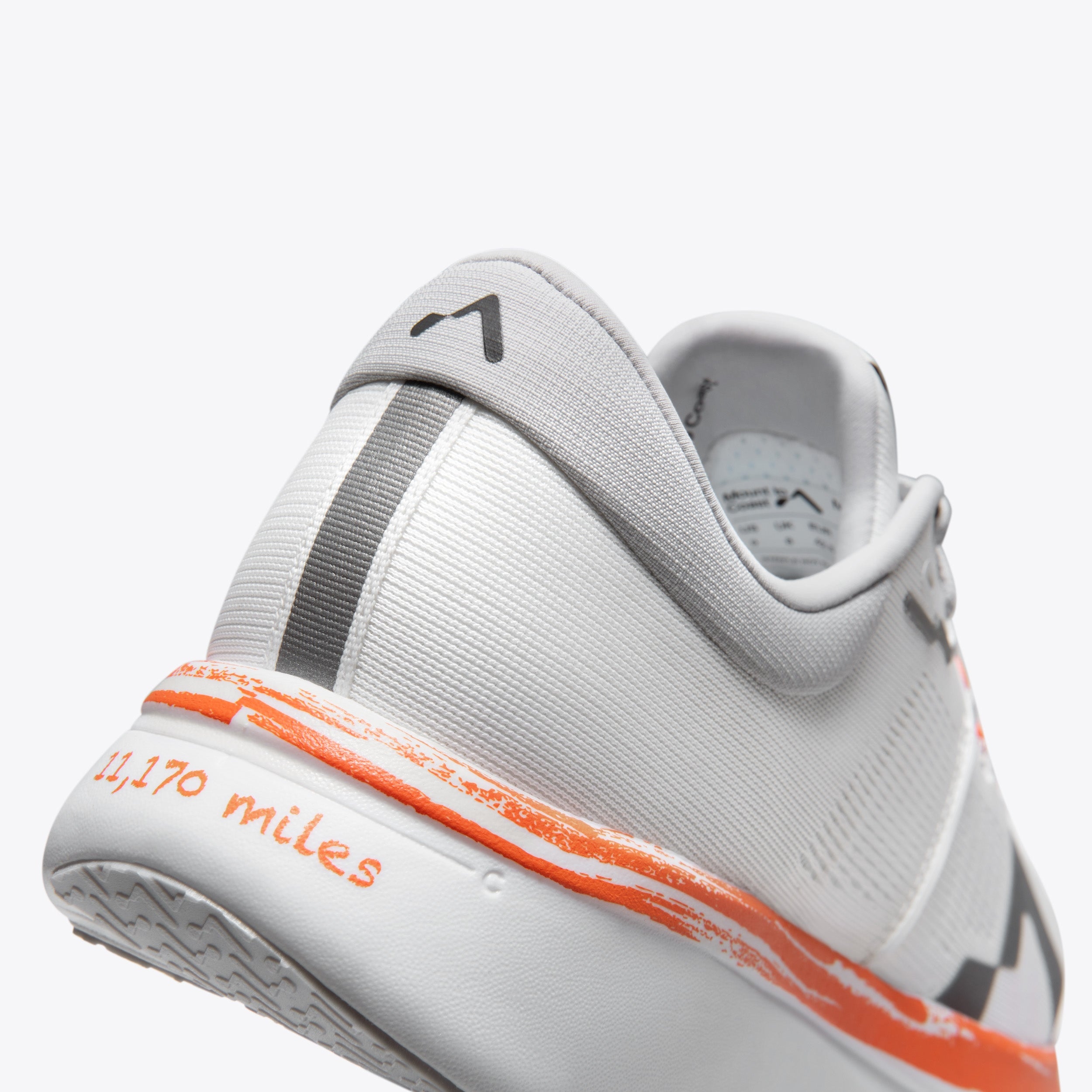 R1 Cam running shoe detail, 11,170 miles, orange accent #Color_cam