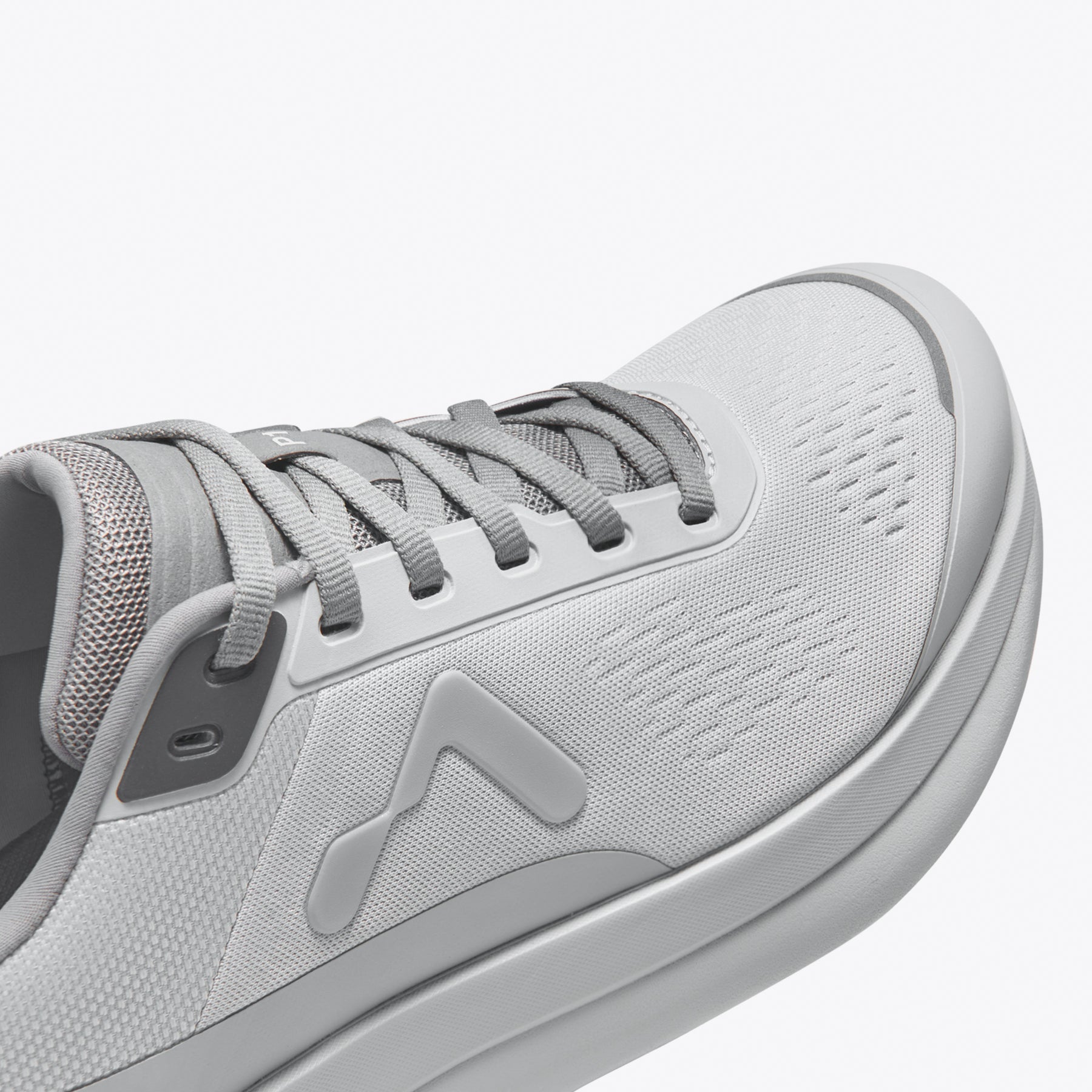 Light gray running shoe with breathable mesh upper and logo