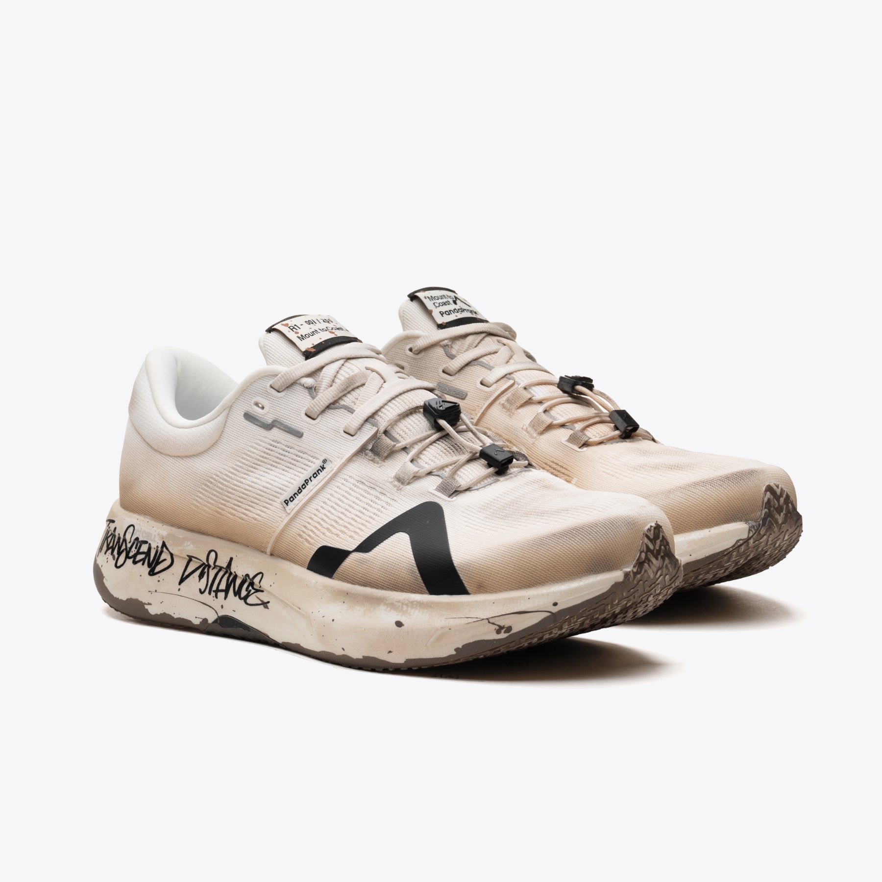 Mount to Coast R1 Legacy ultrarunning shoe. Beige with black accents, designed for performance.