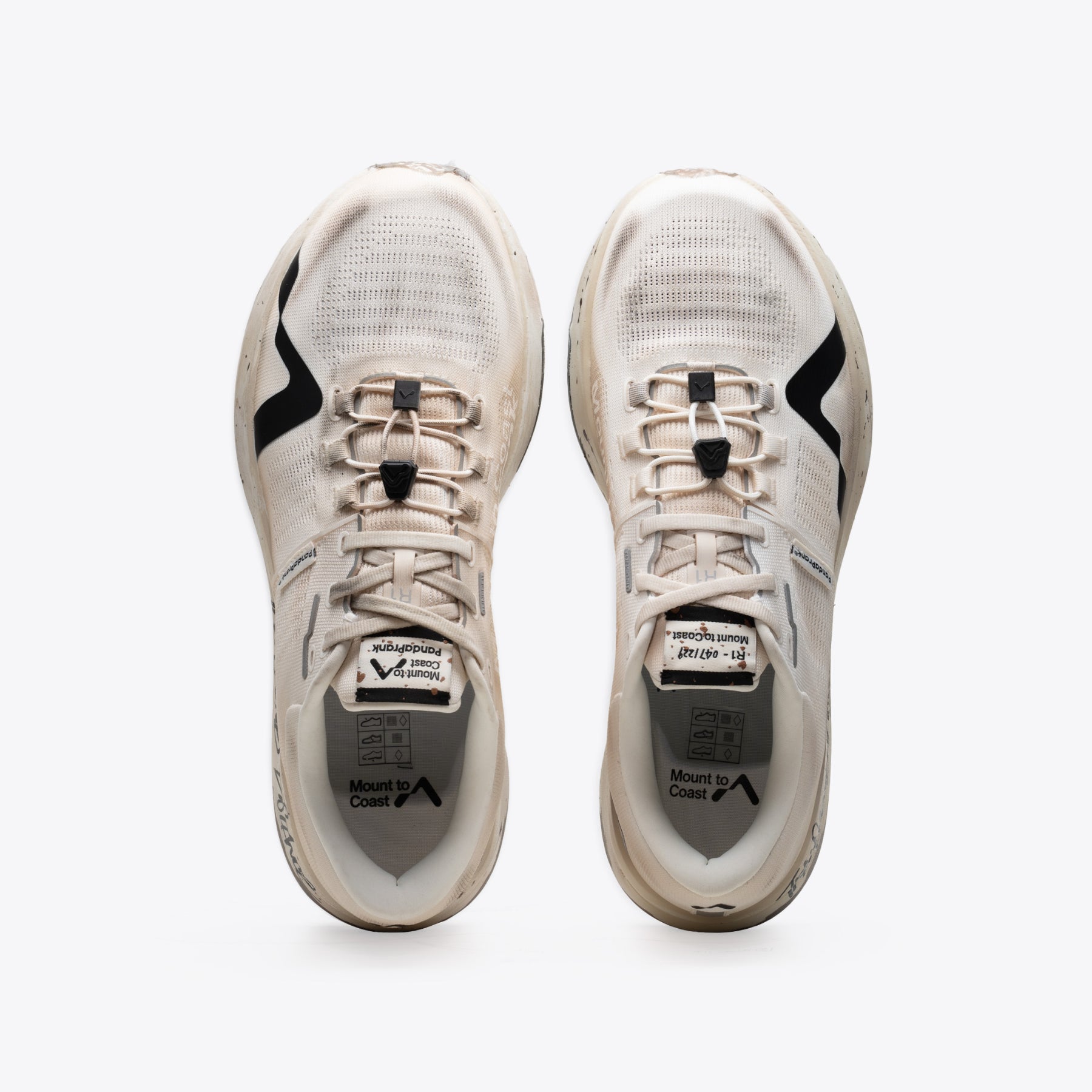 R1 Legacy trail running shoes from Mount to Coast. Beige and black colorway, durable design, made for ultrarunners.