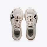 R1 Legacy trail running shoes from Mount to Coast. Beige and black colorway, durable design, made for ultrarunners.