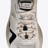 R1 Legacy trail running shoe, cream and black. Mount to Coast branding, ultrarunner design, product code.