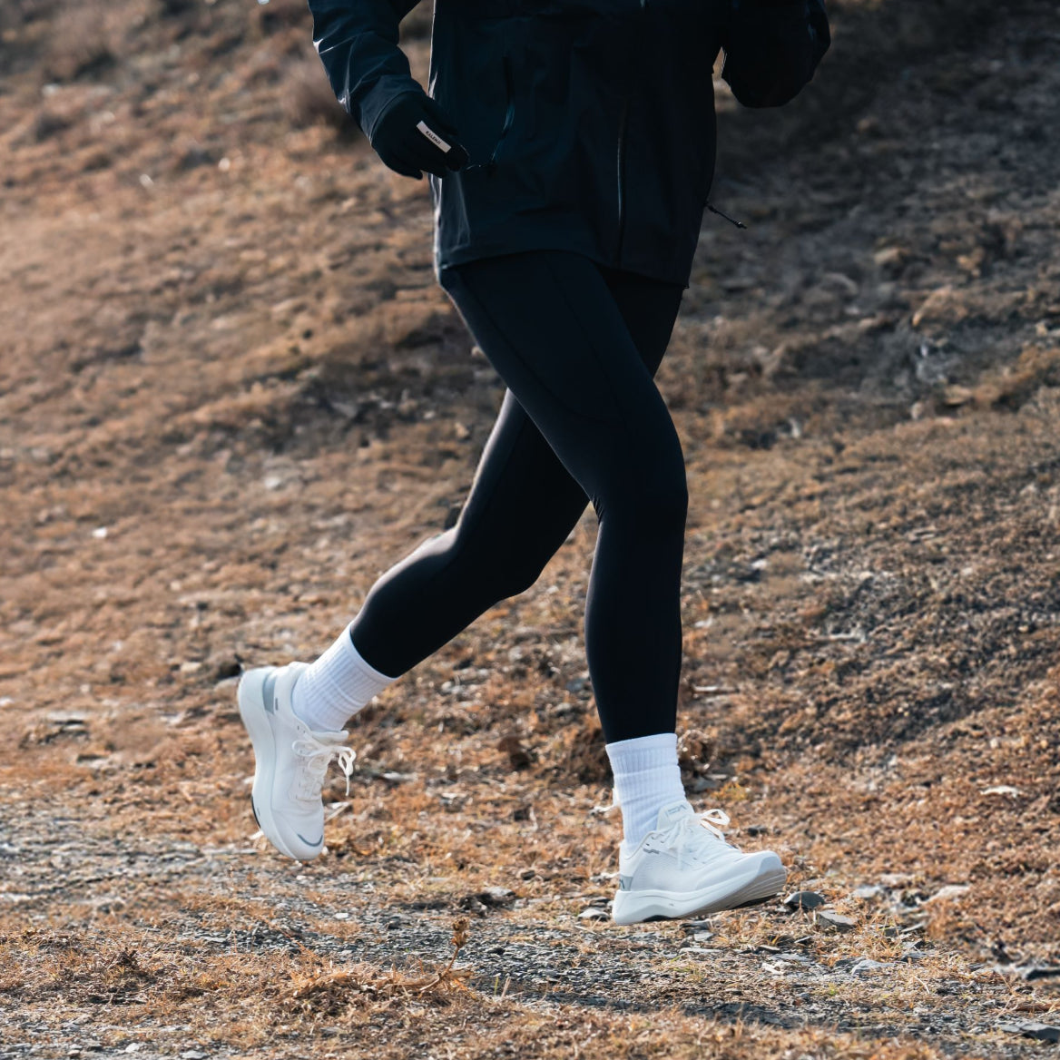 Mount to Coast S1 running shoe in action on a trail #Color_white