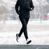 Runner wearing Mount to Coast S1 running shoes in snowy weather #Color_white|black
