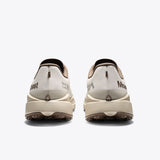 Mount to Coast T1 trail running shoes rear view. Beige and brown colorway. Brand logo and design detail on the heel.
#Color_dune