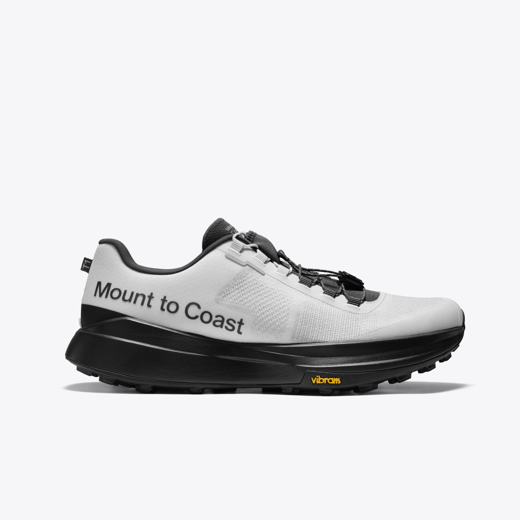 Mount to Coast T1 trail running shoe, white and black colorway, Vibram sole for long-distance adventures.
#Color_tephra
