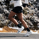 Mount to Coast R1 running shoe in action, ideal for road running. #Color_white