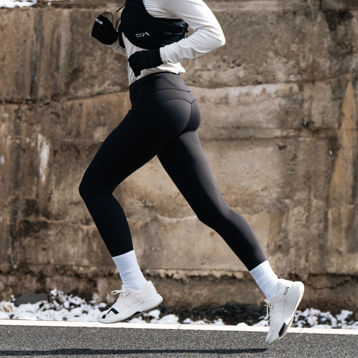 Athlete Running in Black Leggings and White Running Shoes #Color_white