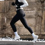 Athlete Running in Black Leggings and White Running Shoes #Color_white