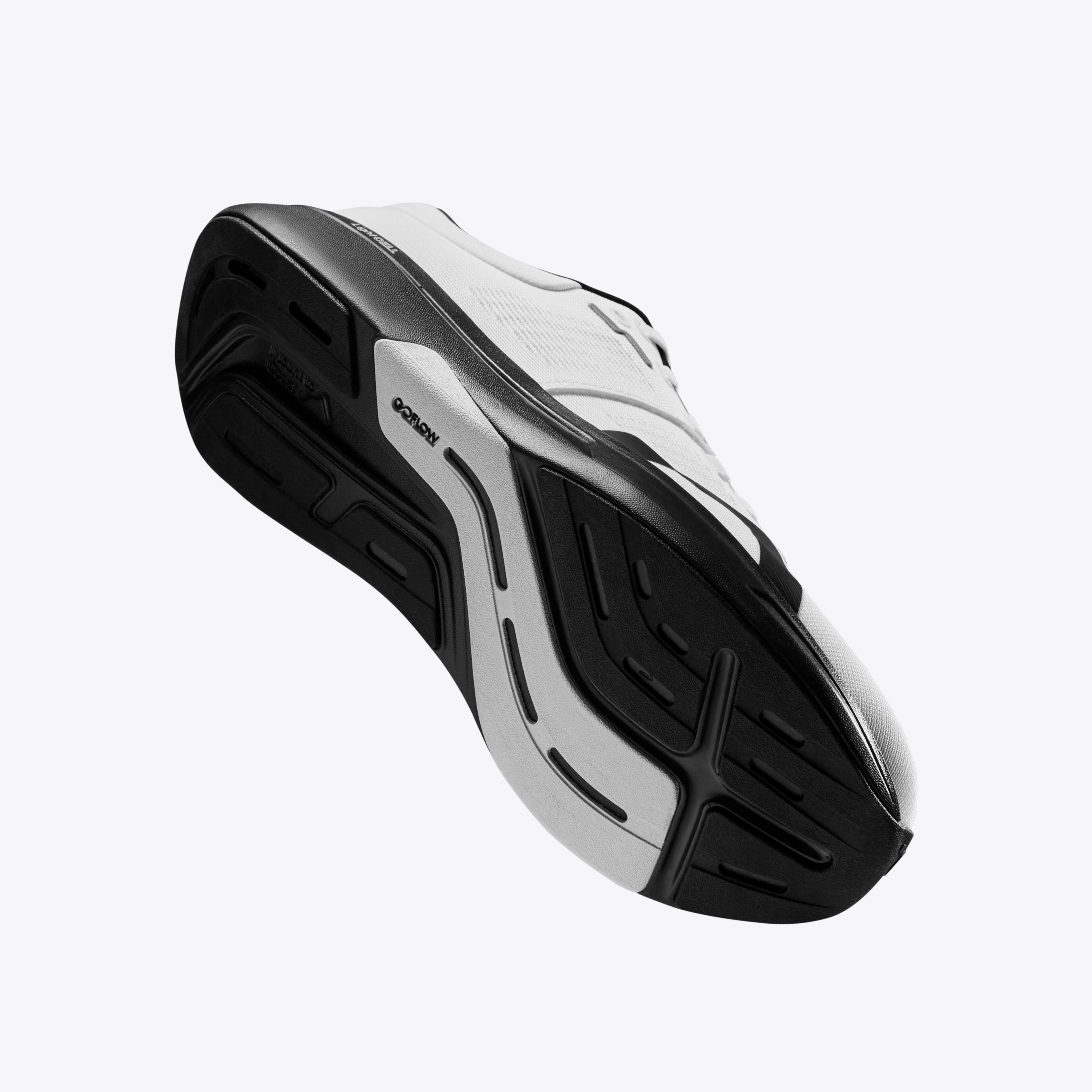 R1R white and black running shoe angled, features a durable rubber outsole for road running. #Color_white|black