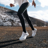Runner in white Mount to Coast S1 shoes on trail #Color_white