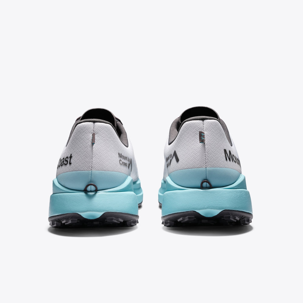 Mount to Coast T1 trail running shoes in gray and aqua. Lightweight design for long-distance trail running and comfort.